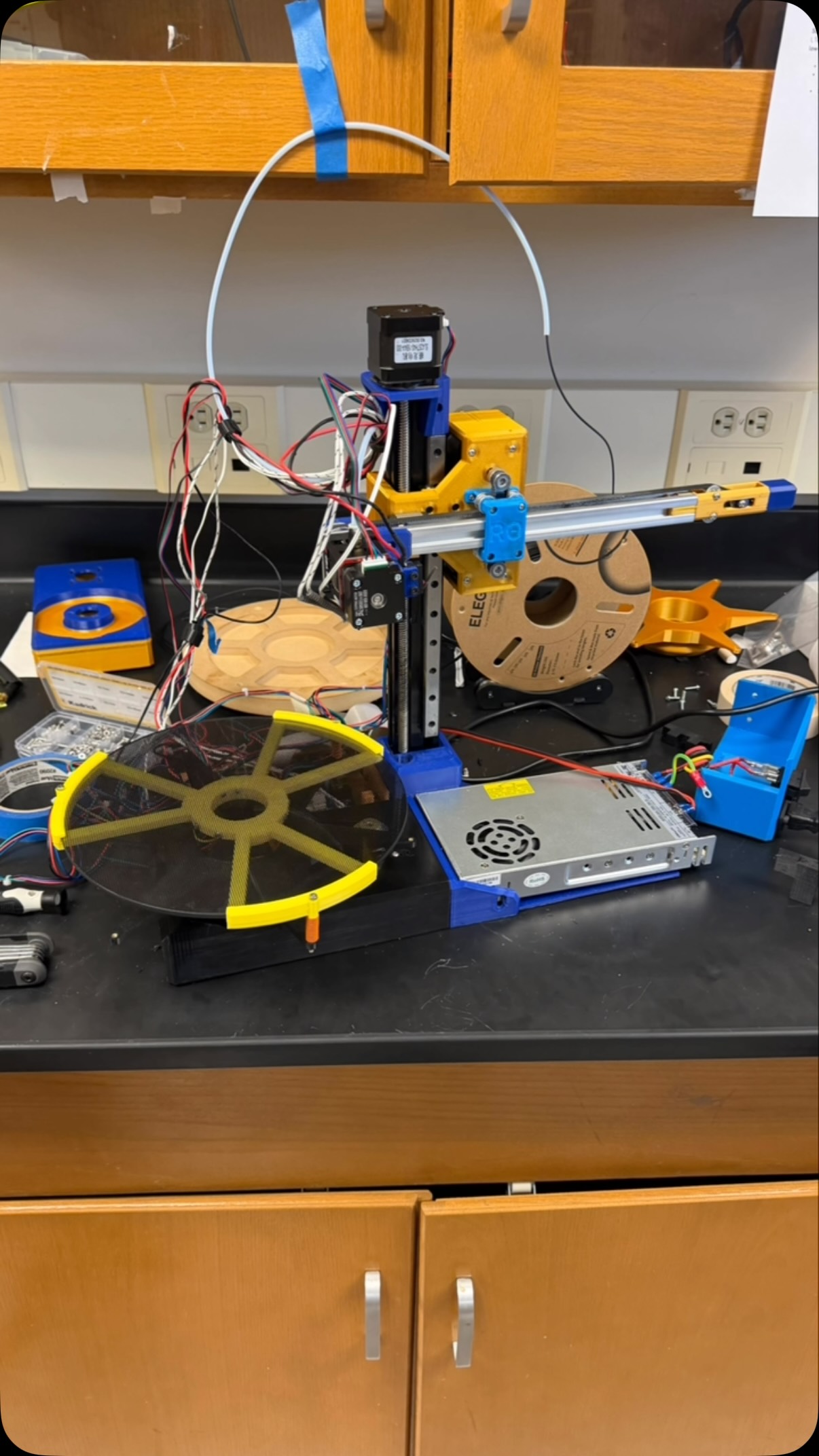 A colorful custom motion system assembled on a laboratory bench